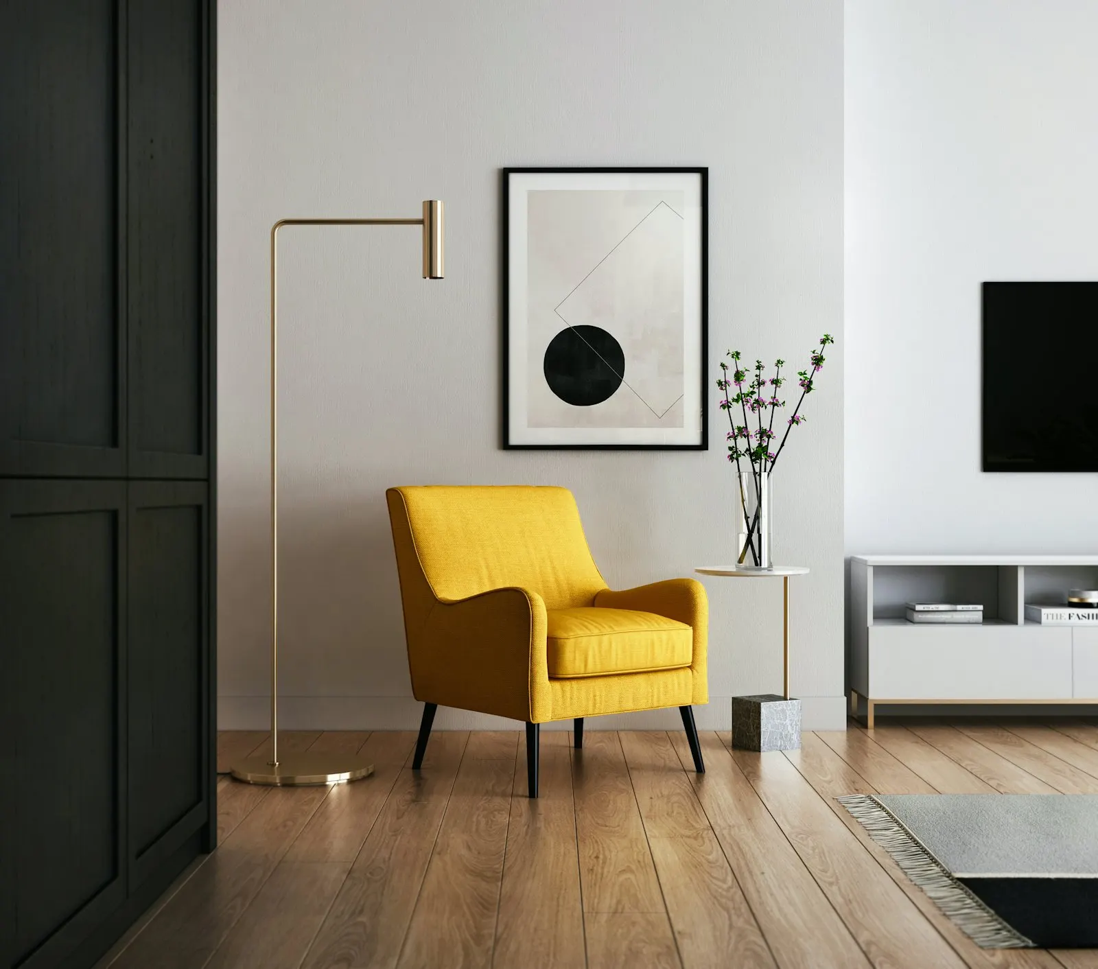 Mustard accent chair beside a low media console with warm layered lighting